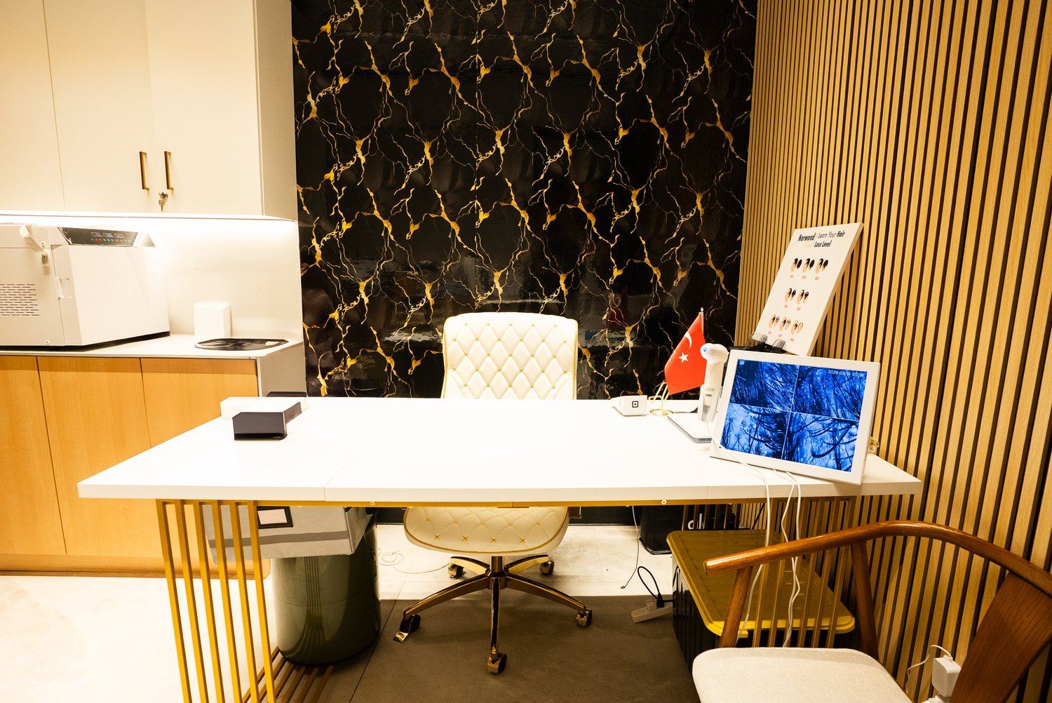 Clinic consultation desk with hair assessment screen